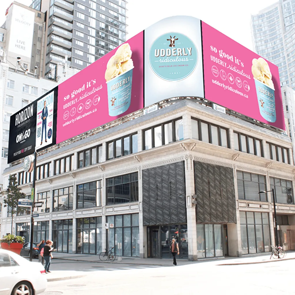 A high-profile digital billboard in Downtown Toronto featuring an Udderly Ridiculous goat milk ice cream advertisement. A testament to the brand’s growth and success.