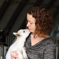 Cheryl haskett owner of udderly ridiculous cuddling a goat in goat cuddles experience